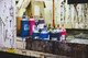Paint room displaying a full spectrum of primary paint colours arranged for mixing, showcasing vibrant reds, blues, and yellows in containers ready for use.